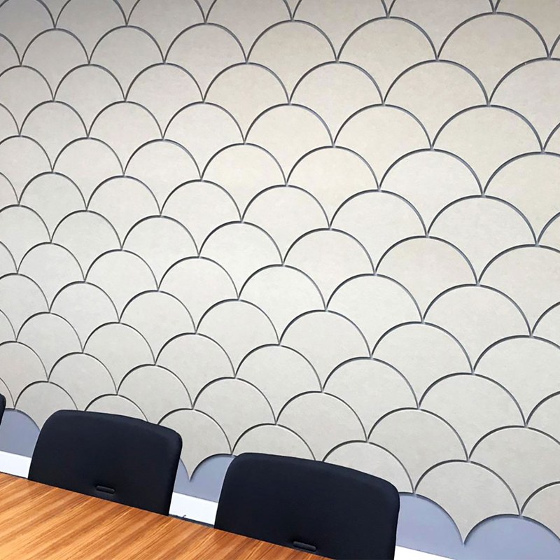 Scale shaped acoustic wall tiles in white and pale blue