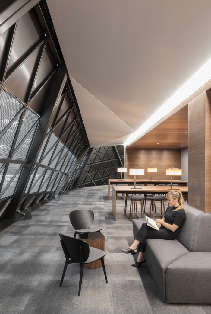 Example placeholder: lounge seating beside an angled glazed facade