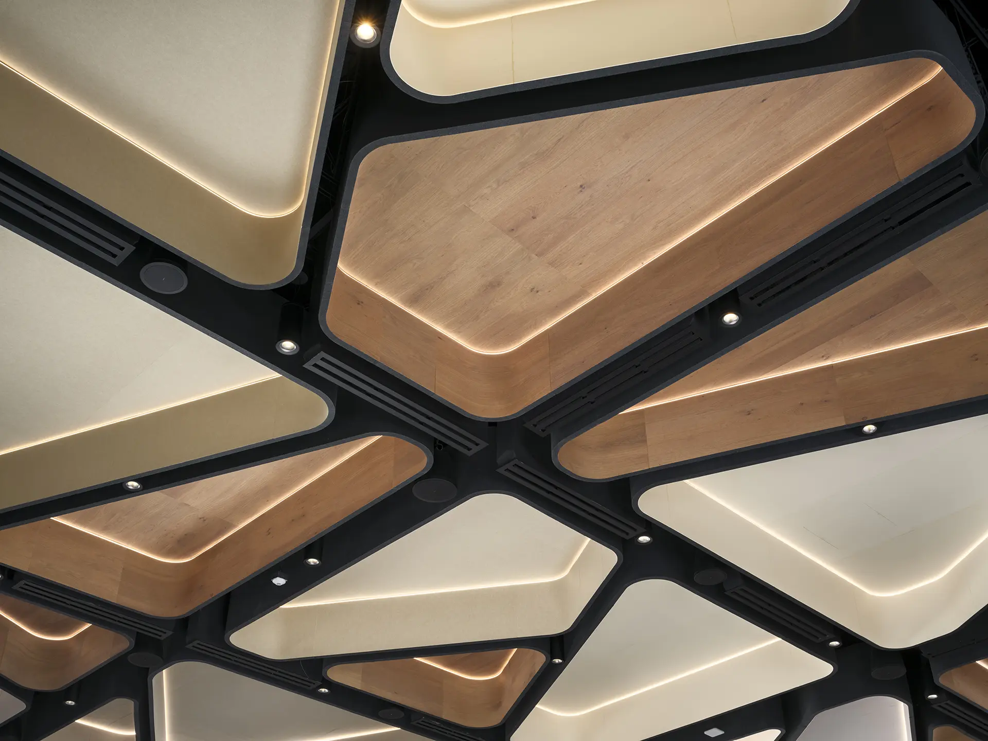 Custom illuminated felt and timber ceiling with faceted backlit panels